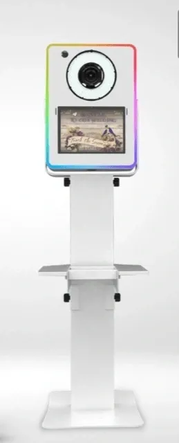 A white stand with a television on top of it.