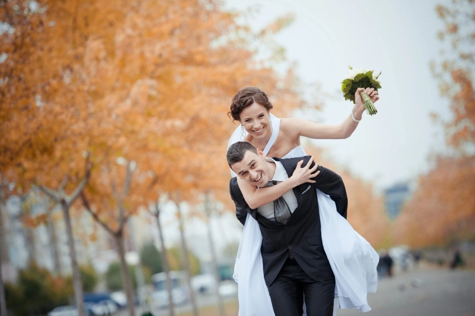 A man and woman are walking down the street.